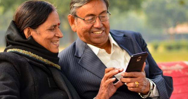 Asian couple looking at phone